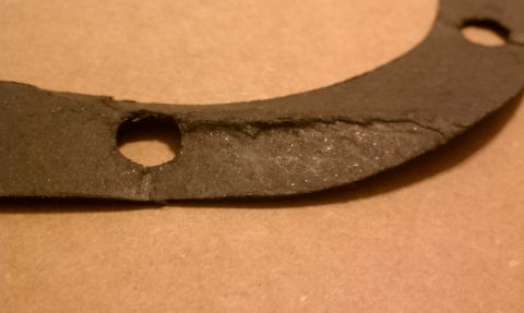 1990 Ford Bronco - This worn gasket shows signs of damage and wear.