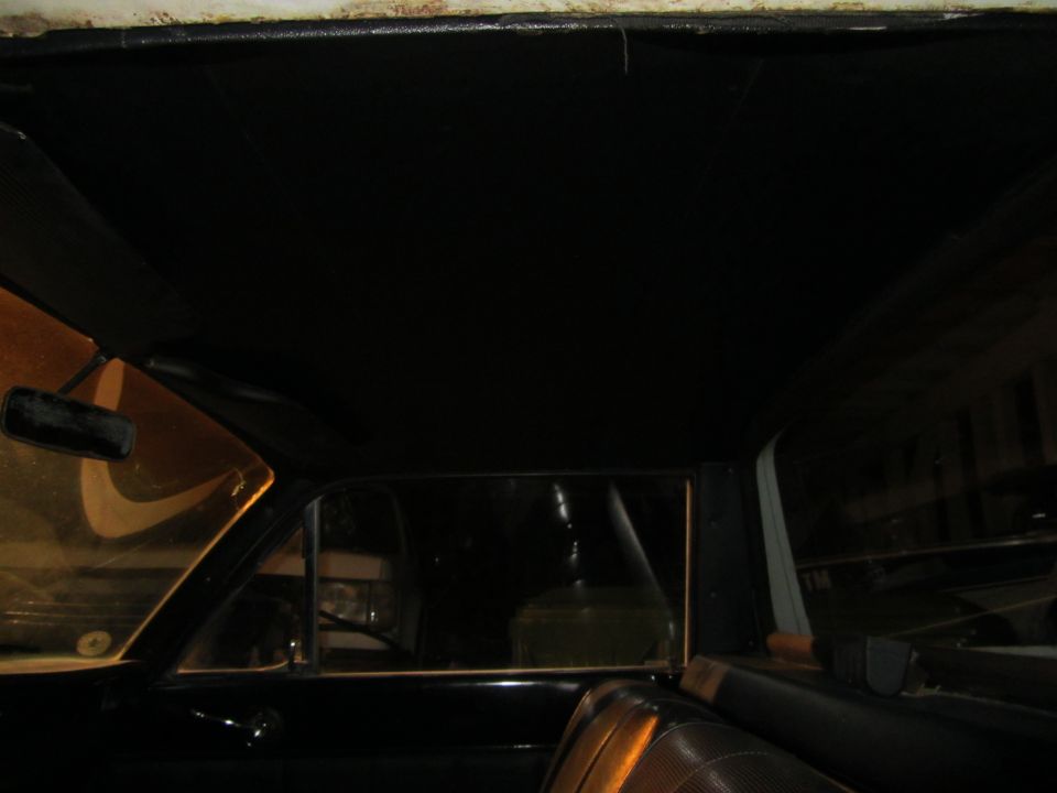 Interior view of a car's headliner and side window