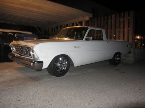 1964 Ford Ranchero - White 1964 Ford Ranchero pickup truck parked under a carport.