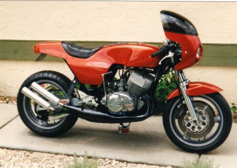 1999 Ford Ranger - Customized cafe racer motorcycle parked outdoors on a concrete surface.