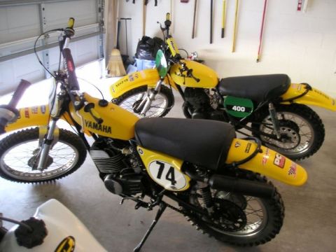1999 Ford Ranger - Two yellow Yamaha dirt bikes are parked side-by-side in a garage.