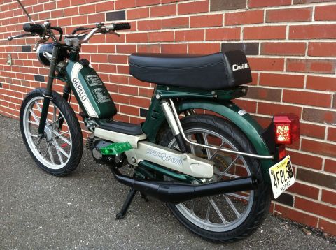 1981 Garelli Rally Sport - This moped features a green body with a white stripe on the gas tank and the name 'GranSport' on the side panel.