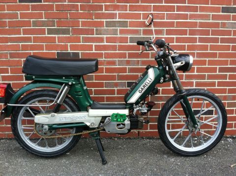 1981 Garelli Rally Sport - A side view of a green moped with 'Garelli' branding on the fuel tank.