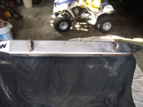 2003 Jeep Wrangler - A custom steel bumper with a prominent 'W' logo and integrated tow hooks is displayed.