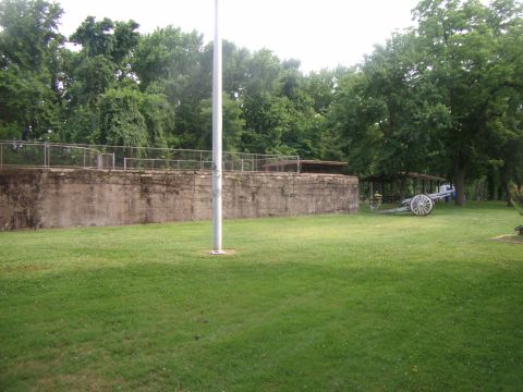 2003 Jeep Wrangler - A vintage cannon sits on display in a park-like setting, with a concrete fortification and trees in the background.