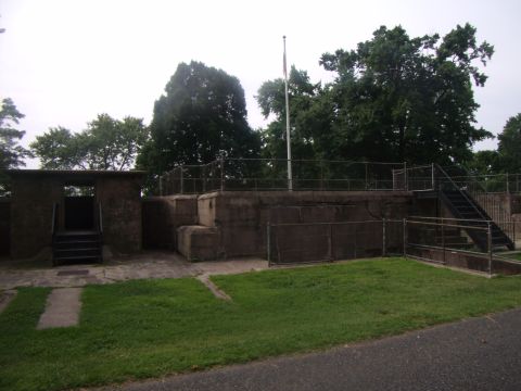 2003 Jeep Wrangler - A concrete structure with a flagpole stands on a grassy area.