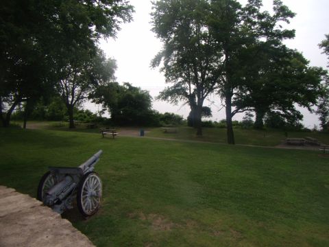 2003 Jeep Wrangler - A park scene with an old cannon in the foreground and trees and benches in the background.