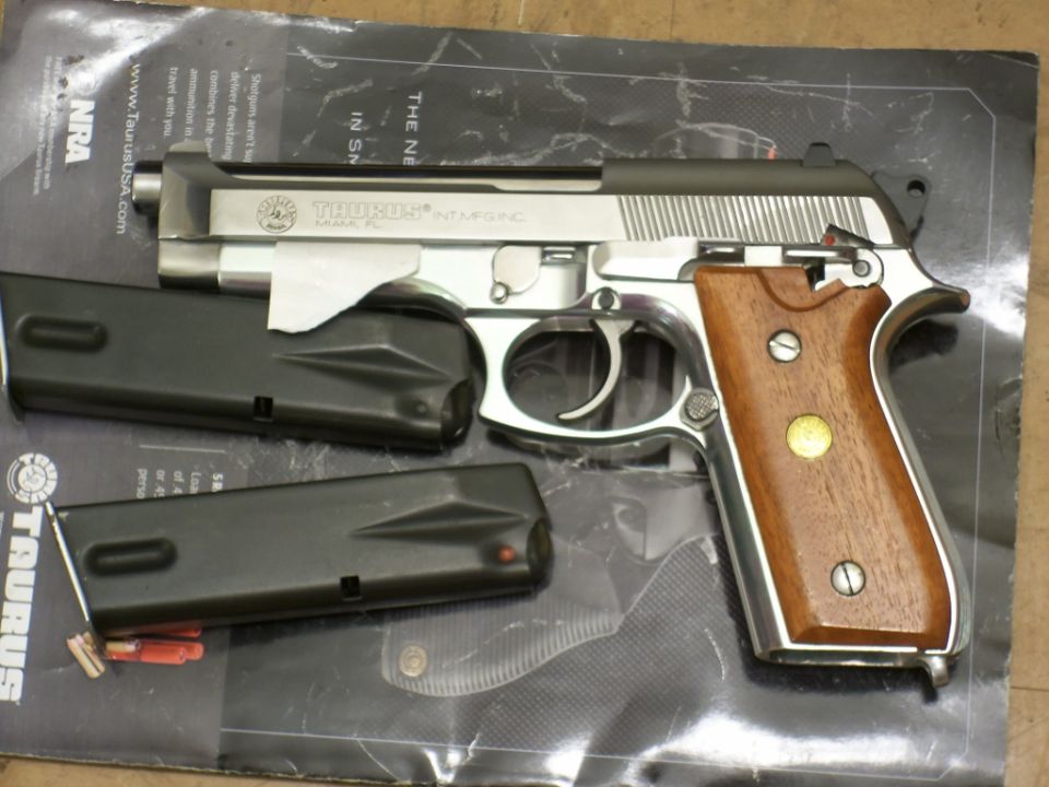 Taurus PT92 AF pistol with wood grips and two magazines