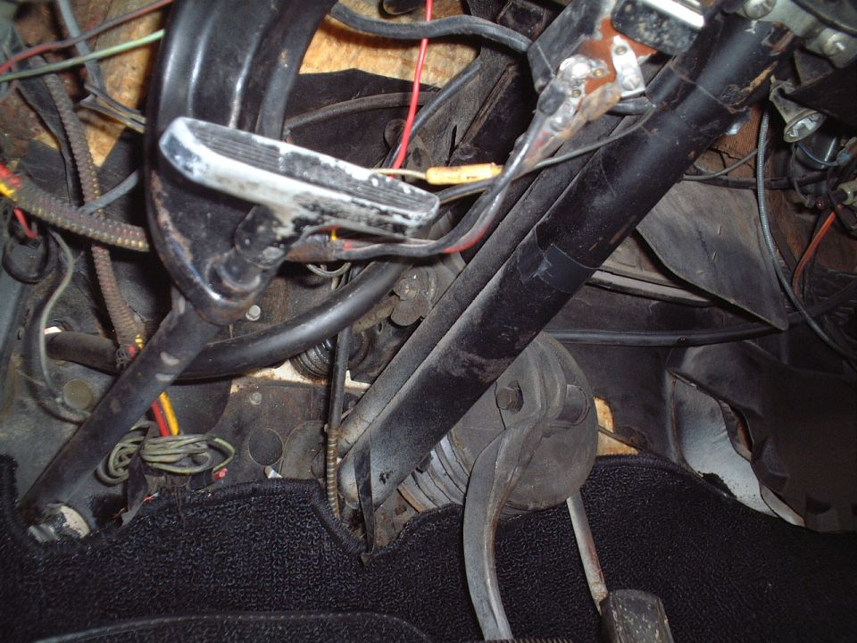 Under dashboard (driver's side)
