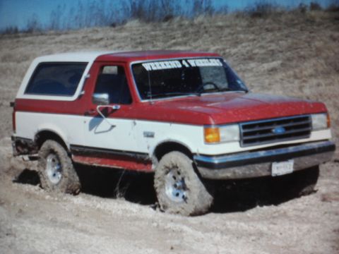 1989 Ford Bronco - This 1989 Ford Bronco is stuck in the mud, showing its front 3/4 view.