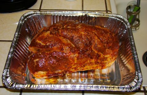 1989 Ford Bronco - Seasoned pork shoulder ready for cooking in a foil pan.
