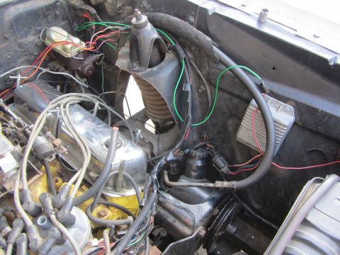 1964 Ford Ranchero - Close-up view of a vehicle's engine bay, showing various components and wiring.