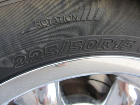 1964 Ford Ranchero - Close-up of a tire showing its size and rotation direction.