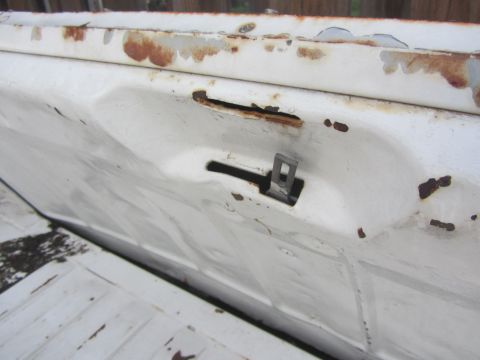 1964 Ford Ranchero - The tailgate latch mechanism shows signs of rust and wear.