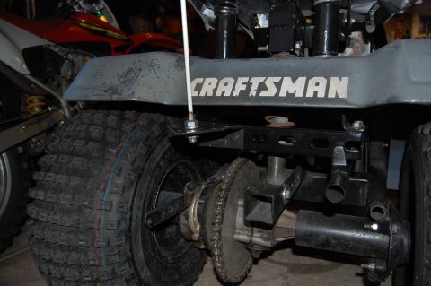 2010 Kawasaki BAYOU 220 - Rear view of a CRAFTSMAN riding mower's axle and drive chain.