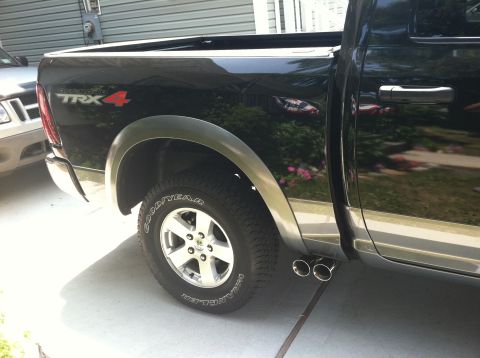 2010 Dodge 1500 - Rear view of a black Dodge Ram pickup truck, showing the TRX4 badging and dual exhaust.