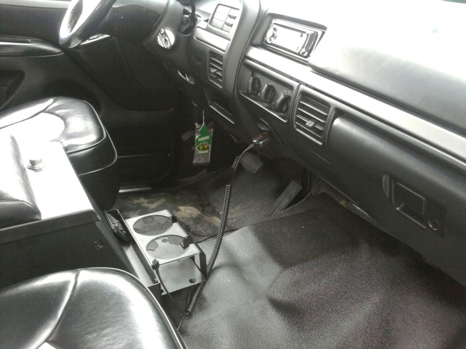 the flooring and TUFFY center console, great because of the lock when top is off. also so added sound deadening and heat shield to the front cab. bronco logo can be seen on brake pedal.