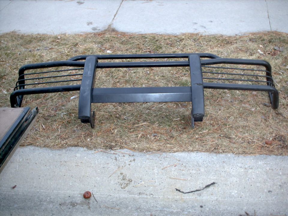 Black bull bar with horizontal slats and vertical supports