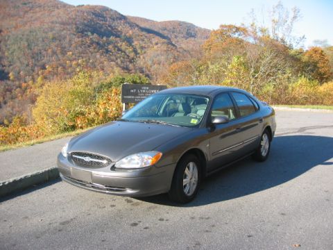 2003 Ford Taurus - Dark gray 2003 Ford Taurus sedan parked at a mountain overlook during autumn.