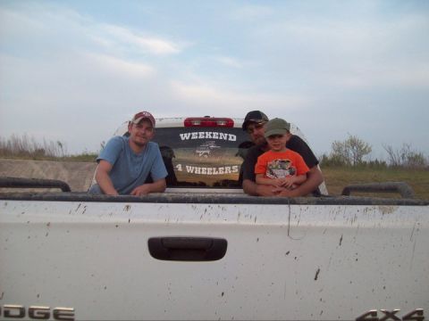 1989 Ford Bronco - People enjoy a day out in the bed of a pickup truck, with a 'Weekend 4 Wheelers' sticker visible.