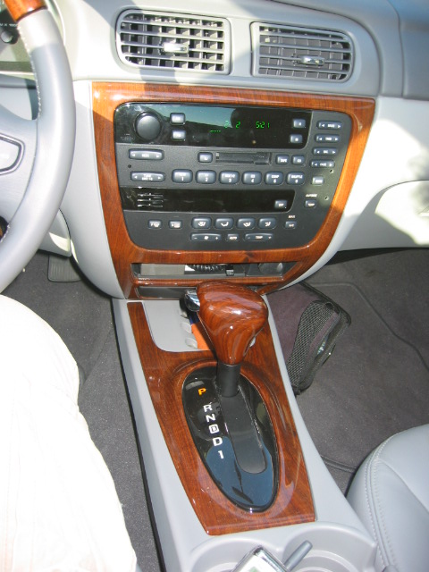 2003 Ford Taurus - Interior view of a 2003 Ford Taurus, highlighting the wood grain trim accents on the console and dash.