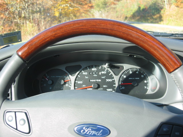 Ford instrument cluster and gauges with wood-grain steering wheel rim
