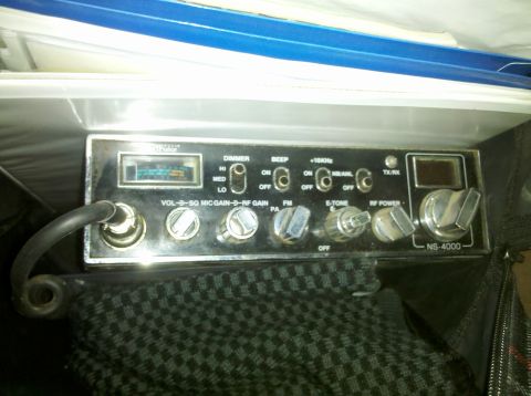 1992 Ford F-150 - A close-up view of a CB radio unit, showing various control knobs and a small display screen.