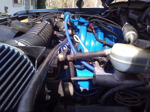 1992 Ford F-150 - Engine bay details with blue intake manifold and air intake system visible.
