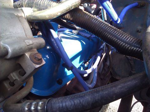 1992 Ford F-150 - Close-up view of an engine bay, highlighting blue valve covers and spark plug wires.