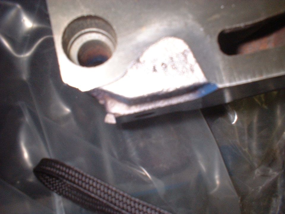 Engine part with visible casting marks and a hole