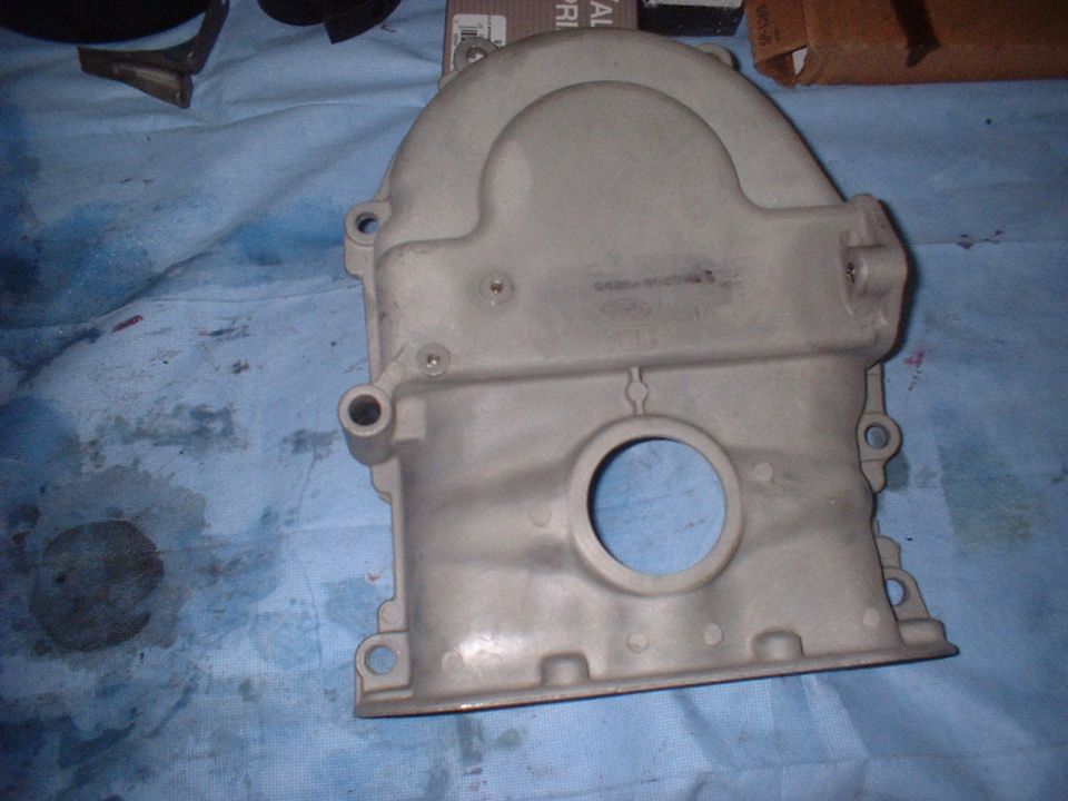 Aluminum engine timing cover with circular opening