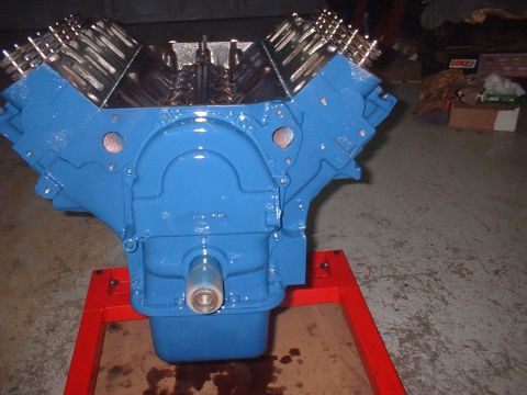 1969 Mercury Cyclone - A freshly painted V8 engine sits on a stand, ready for installation.