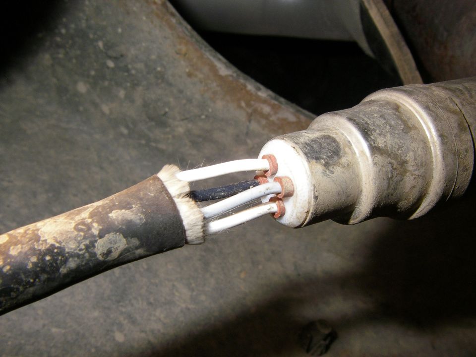 close-up of oxygen sensor with four wires exposed