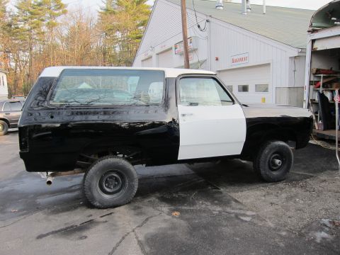 1987 Dodge 1500 - Side view of a 1987 Dodge Ramcharger undergoing bodywork, showing two-tone paint.
