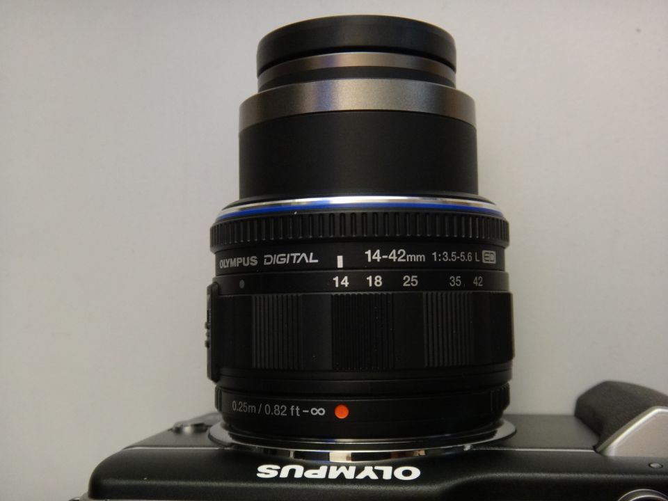 Olympus digital camera lens with 14-42mm zoom range