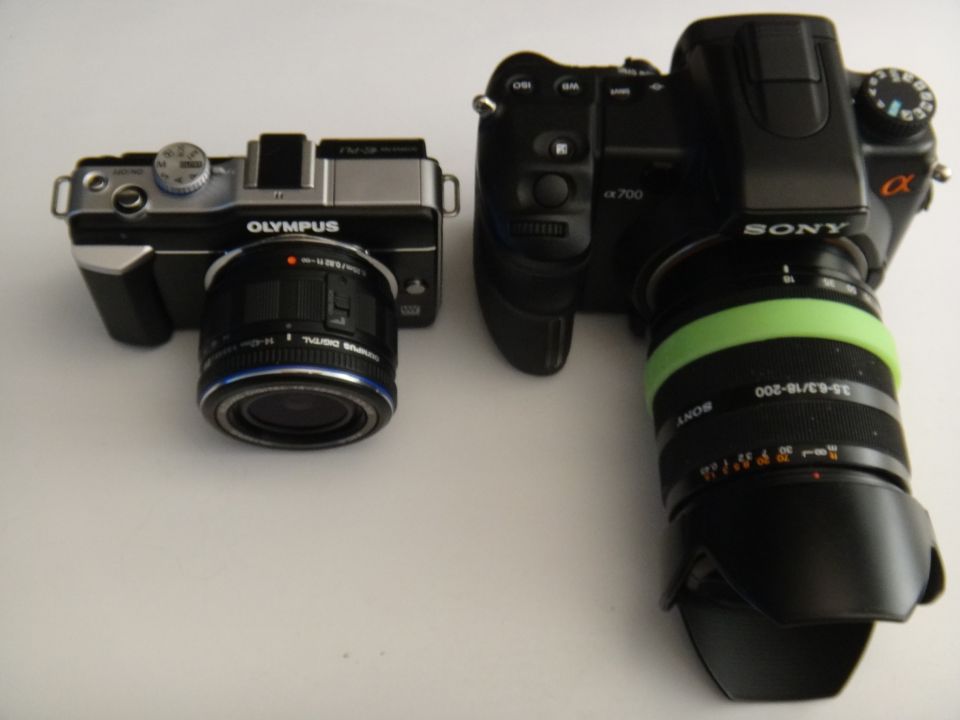 Olympus and Sony digital cameras side-by-side