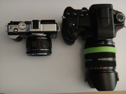 1993 Ford Taurus - Two digital cameras, an Olympus and a Sony, are placed next to each other.