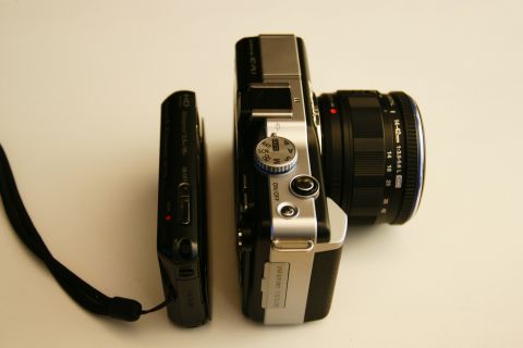 1993 Ford Taurus - Comparison of a small point-and-shoot camera and a larger mirrorless camera.
