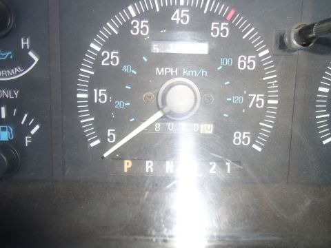 1987 Ford F-150 - Dashboard view of a 1987 Ford F-150, showing the speedometer and gear selector.