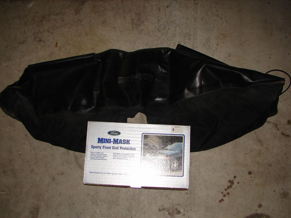 Ford Mini-Mask sporty front end protection box next to a black car bra