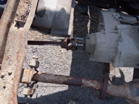 1987 Ford Ranger - Close-up view of the drivetrain components, showing the driveshaft and transmission housing.