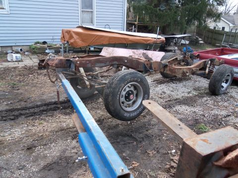 1987 Ford Ranger - This heavily rusted truck frame, stripped of its body, is the subject of a "Tear Down" section, with its year and make uncertain.