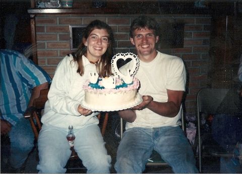 1987 Ford Ranger - A couple smiles while holding a cake with a heart-shaped topper.