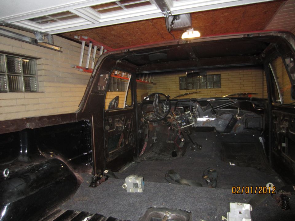Interior of a disassembled SUV, showing dashboard and empty cabin