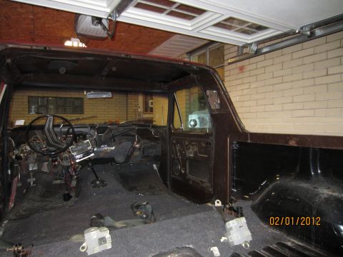 1979 Ford Bronco - Interior view of a 1979 Ford Bronco undergoing restoration, with most components removed.