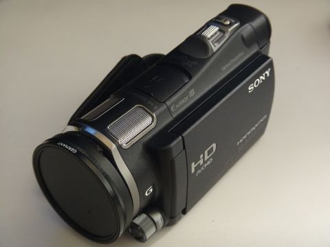 1993 Ford Taurus - A black Sony Handycam camcorder is shown from a three-quarter front angle against a plain background.