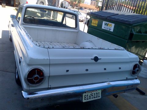 1965 Ford Mustang - This 1965 Ford Falcon Ranchero features a classic rear-end design with prominent "FORD" badging and a California license plate.