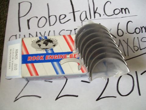 1994 Mazda MX-6 - Engine bearings and their packaging are displayed on a paper with handwritten text and a Supermotors.net logo.