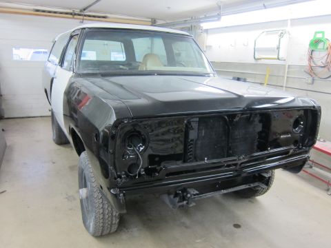 1987 Dodge 1500 - This 1987 Dodge 1500 is undergoing bodywork, with its front end disassembled in a garage setting.