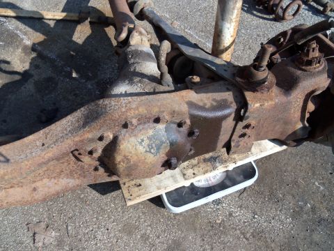 1987 Ford Ranger - Close-up of heavily rusted vehicle suspension parts resting on a bathroom scale.